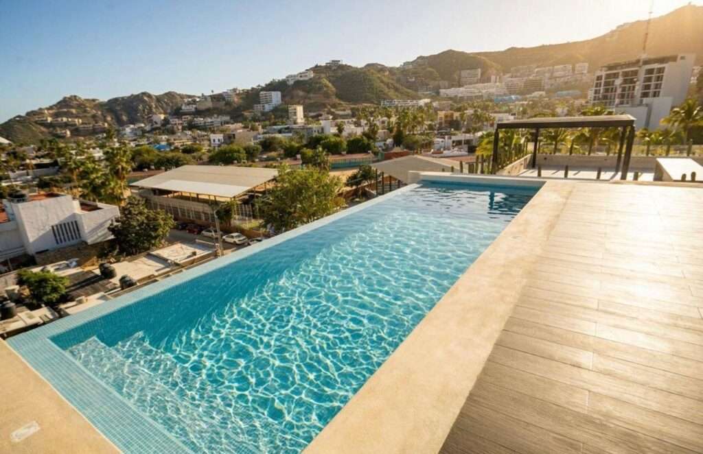 Los Cabos Best Suites Best Suites, comfort in the heart of San Lucas. Prime location just a 6-minute walk distance to Marina San Lucas. A complex with only 17 units offering an exceptional opportunity for investment and short or long-term rentals. Modern design. Infinity pool and roof garden with Marina – BEST SUITES CONDO, Cabo San Lucas, Cabo San Lucas, BS